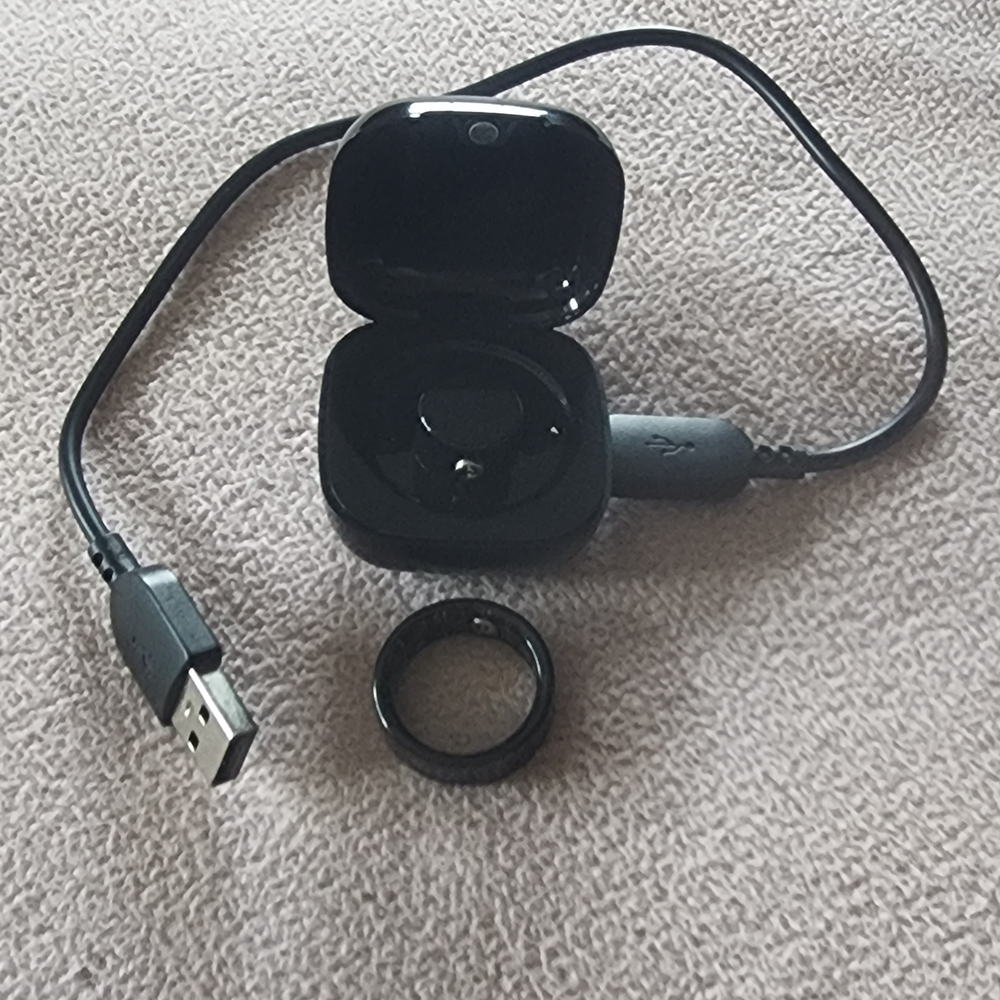 Sleek Black Smart Ring with Charging Case